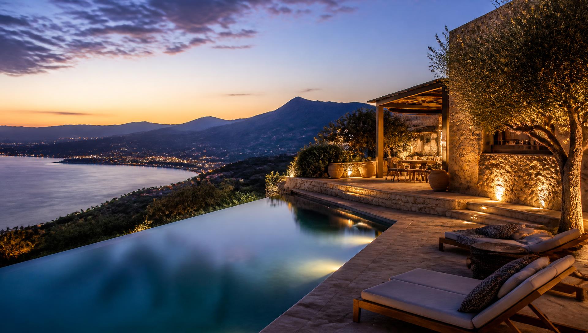 Luxury villa terrace at dusk with private pool and sea view, Crete